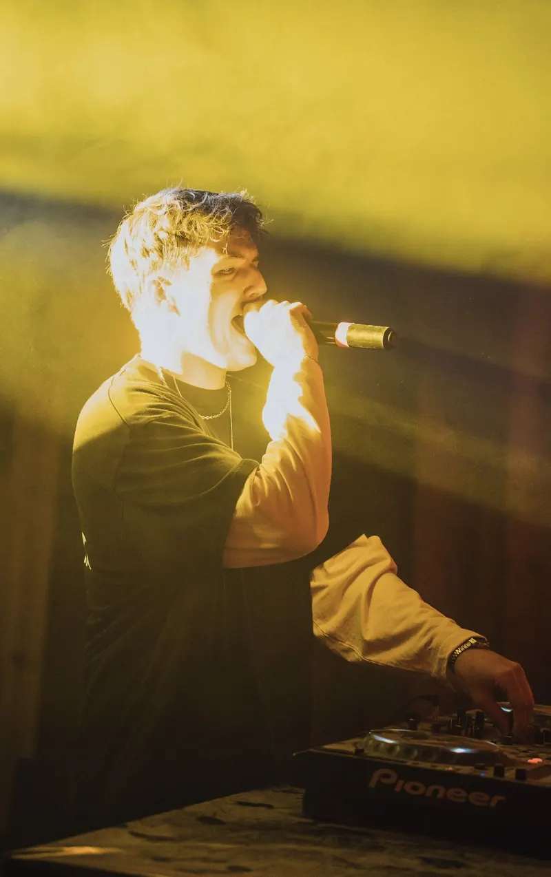 MĀT singing in golden light