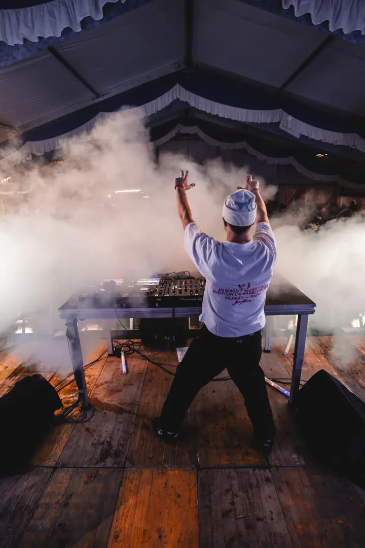 MĀT in the smoke above the crowd
